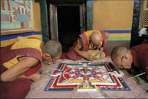 Preparation of a Mandala. Using colored powder to draw, the monks depict the inner growth that develops in their mind Preparation of a Mandala. Using colored powder to draw, the monks depict the inner growth that develops in their mind