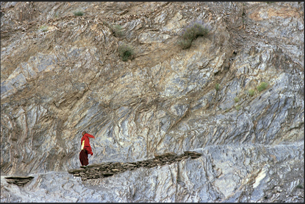 Town of Leh. A young Buddhist monk along the path leading into the town Town of Leh. A young Buddhist monk along the path leading into the town