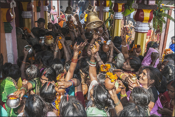 Harihar Nath temple. Pilgrims play the bell (sign of respect to the deity) and then throw the water in direction of the deity